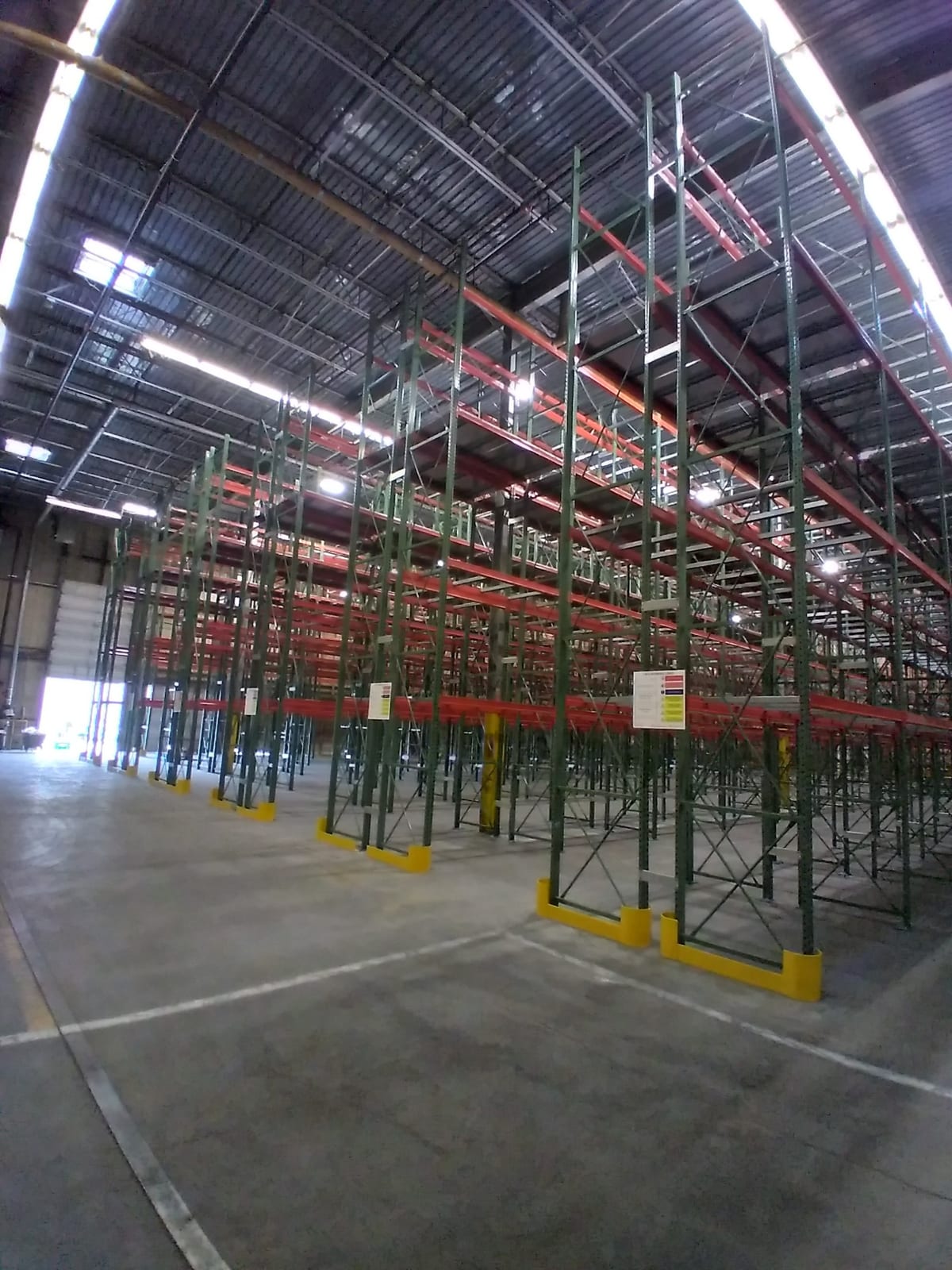 Very narrow aisle pallet racking five levels high with column protection installed in an existing warehouse